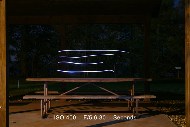 Light streaks above a picnic table