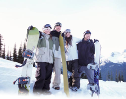 snowboarding group posing for group picture
