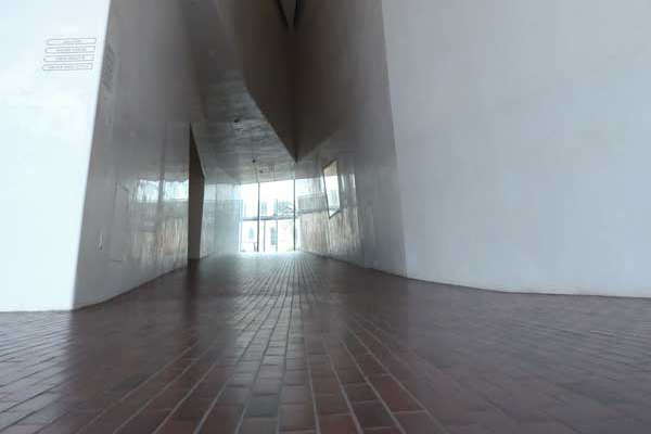 photo of a brick floor hallway in a museum