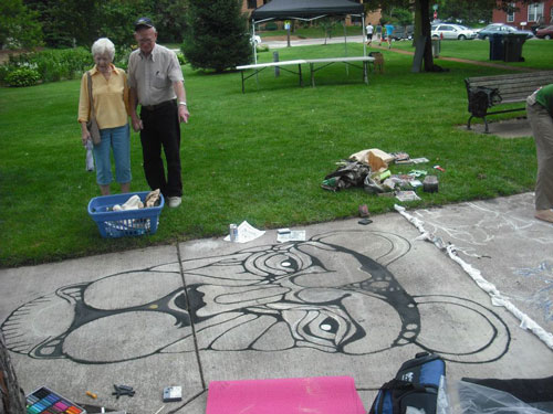 Onlookers watching art in the making